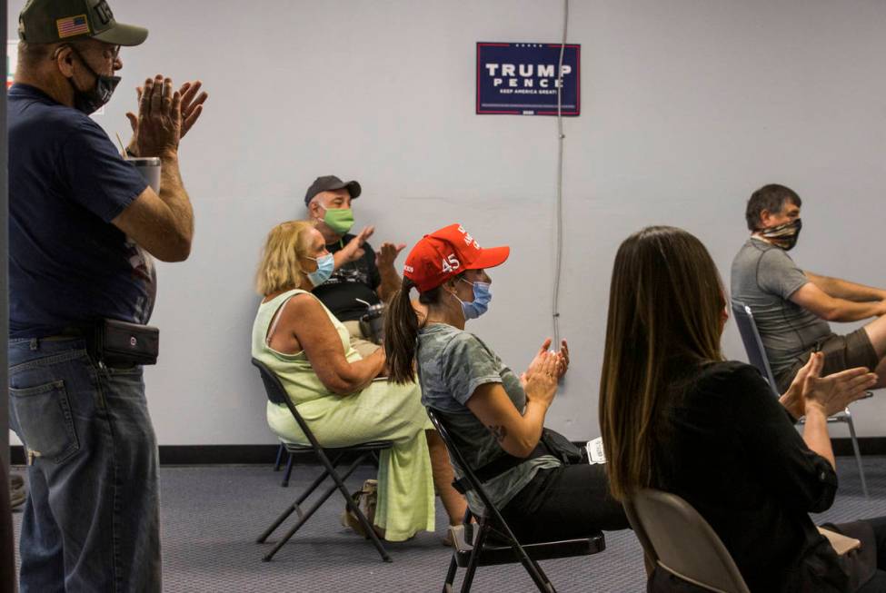 Volunteer Cassandra Hoer, center, applauds with others as they receive in-person training at Pr ...