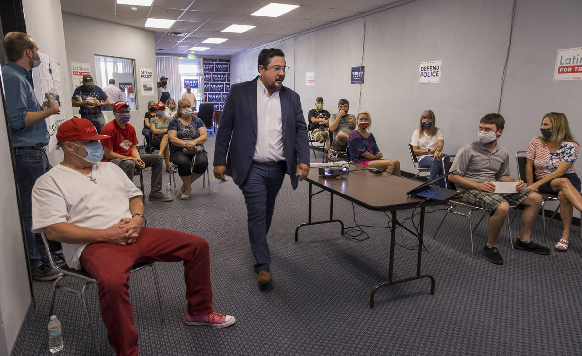 Nevada Assemblyman Glen Leavitt walks up to address volunteers as they receive in-person traini ...