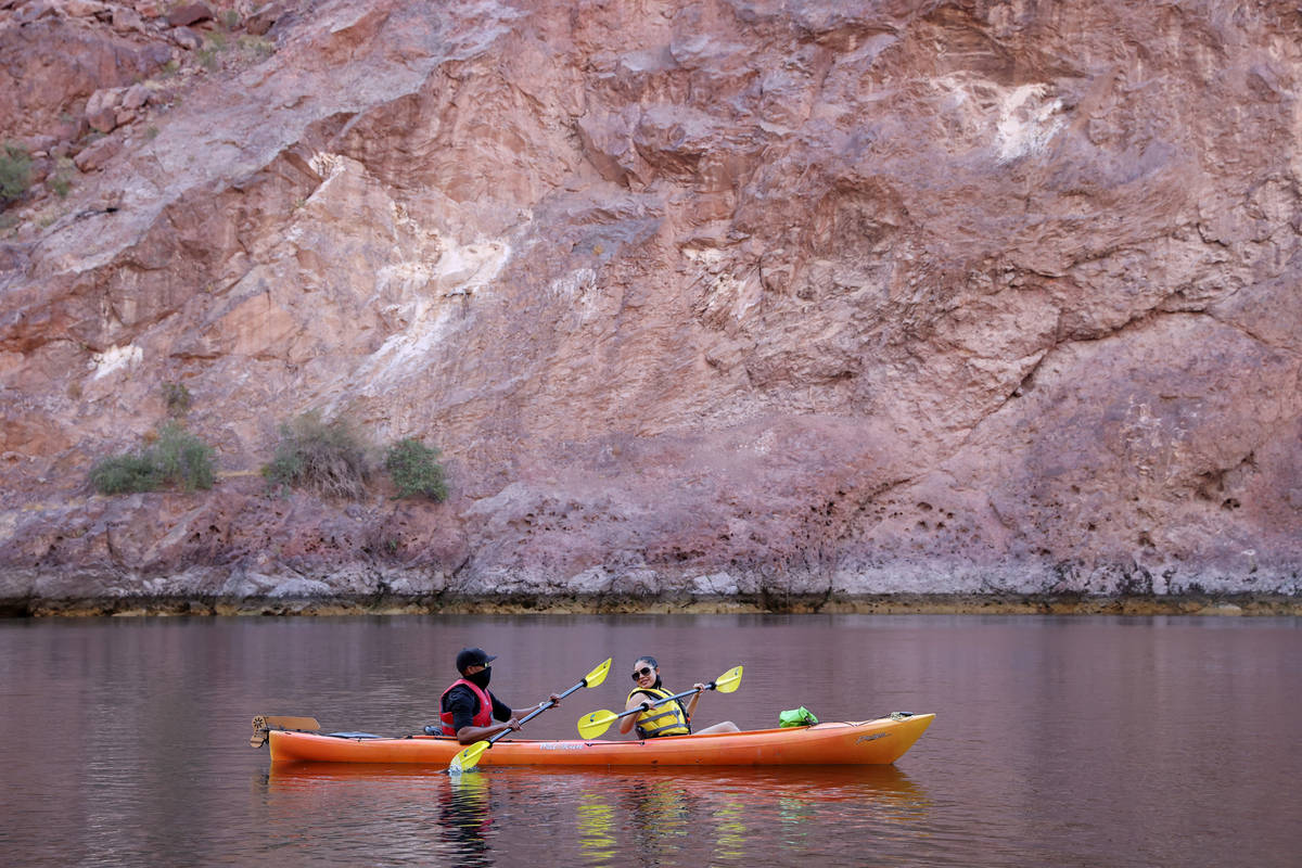 Jonathan Boyles and Dayana Garcia, both of Las Vegas, kayak on the Colorado River in Black Cany ...