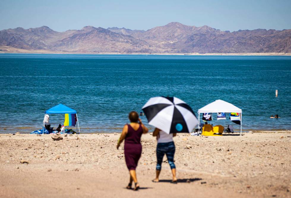 People walk to Boulder Beach at Lake Mead National Recreation Area on Wednesday, July 29, 2020. ...