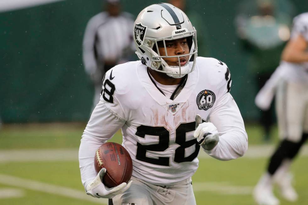 Oakland Raiders cornerback Nevin Lawson (26) returns a kickoff during the first half of an NFL ...