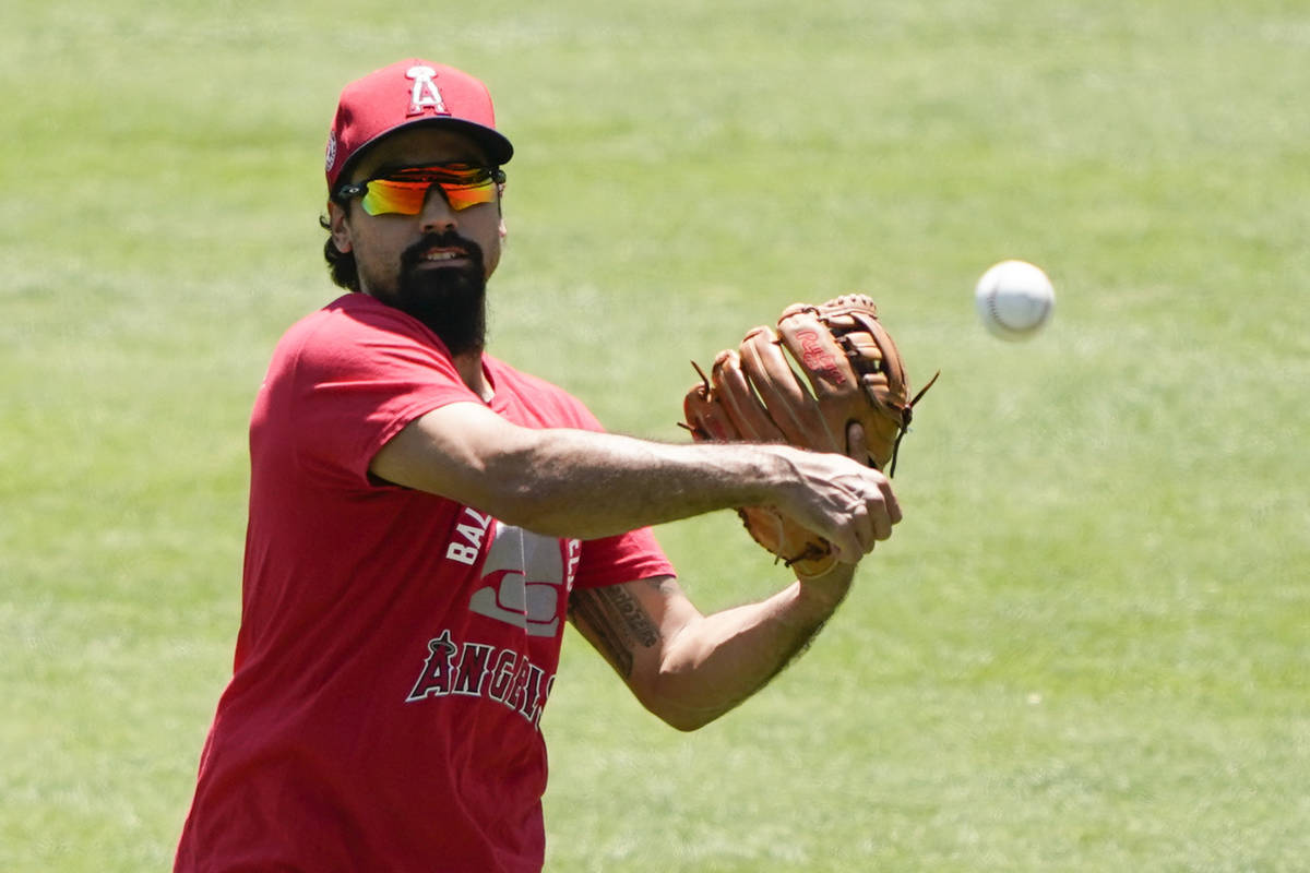 Los Angeles Angels third baseman Anthony Rendon throws during practice at Angels Stadium on Fri ...
