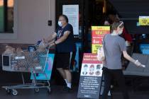 Customers enter and exit the Smith's Food & Drug on West Charleston Boulevard ahead of Inde ...