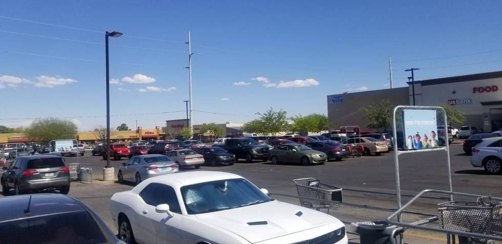 The parking lot of the Smith's is packed at 8555 West Sahara Ave. in Las Vegas, Friday, July 3, ...