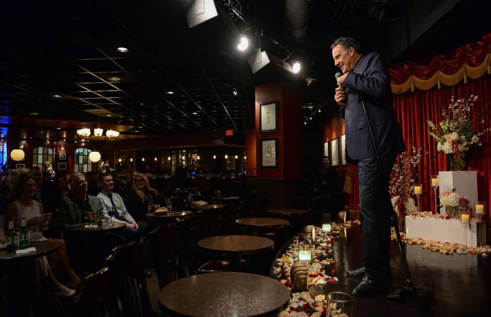 Comedian Brad Garrett, left, officiates the wedding of Cyndi Nelson and comedian Rob Sherwood ...