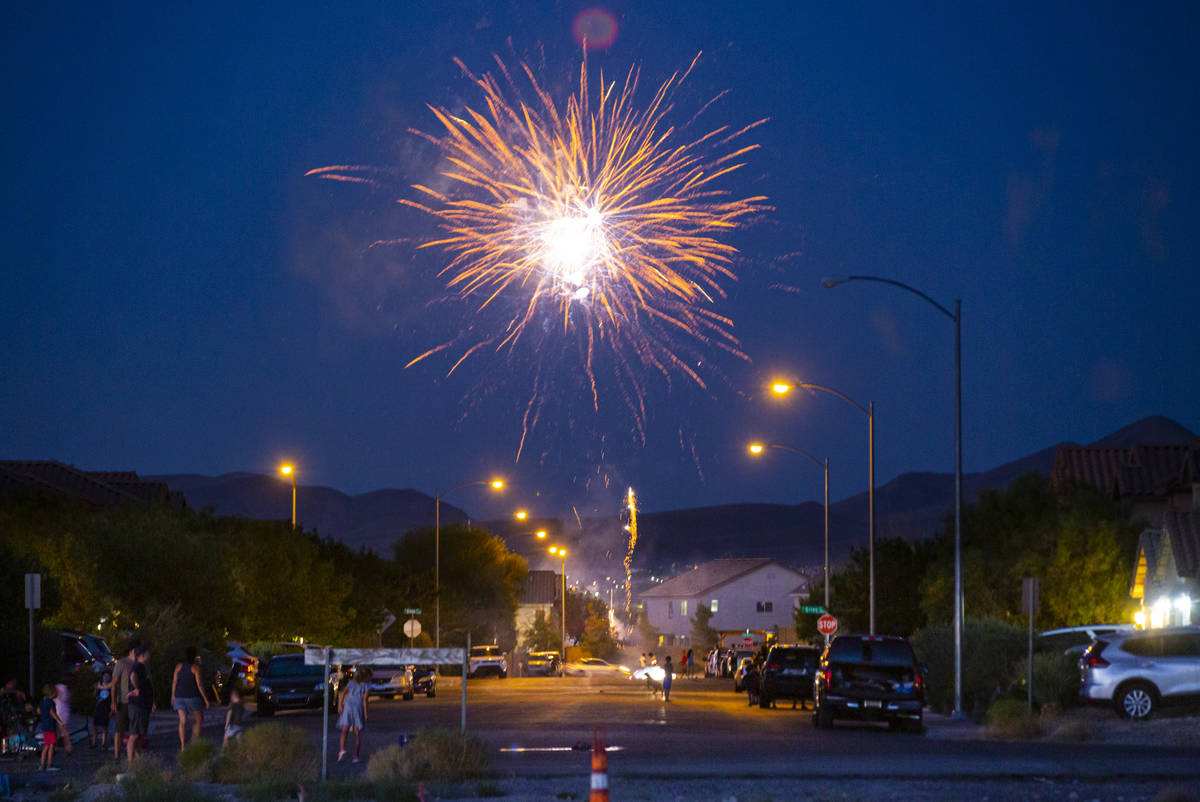 People set off fireworks along Desert Palm Drive in Las Vegas on Saturday, July 4, 2020. (Chase ...