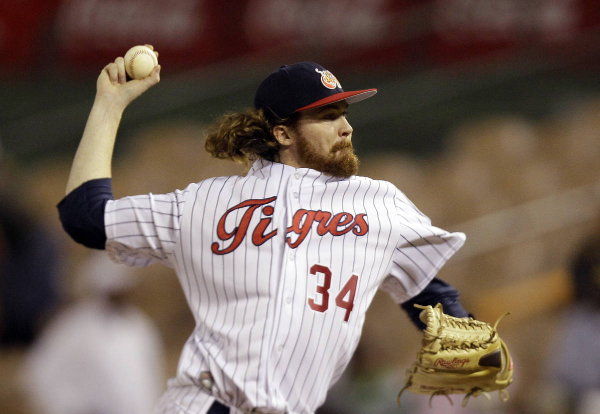 FILE - In this Feb. 3, 2012, file photo, Venezuela's starting pitcher Tyson Brummett throws in ...