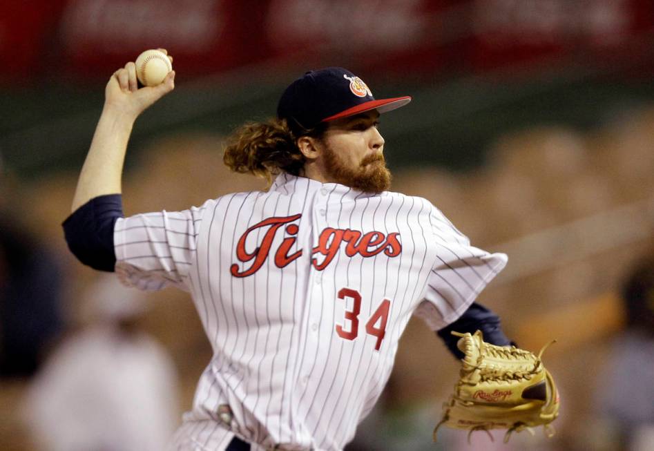 FILE - In this Feb. 3, 2012, file photo, Venezuela's starting pitcher Tyson Brummett throws in ...