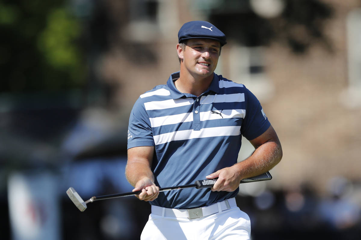 Bryson DeChambeau reacts after missing a birdie putt on the 11th green during the final round o ...