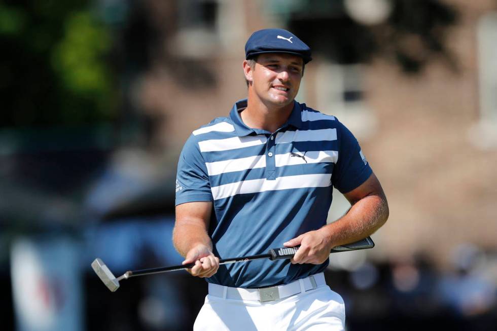 Bryson DeChambeau reacts after missing a birdie putt on the 11th green during the final round o ...