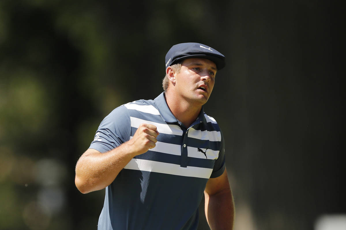 Bryson DeChambeau pumps his fist after a birdie putt on the 10th green during the final round o ...