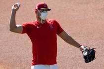 Los Angeles Angels center fielder Mike Trout throws during baseball practice at Angels Stadium ...