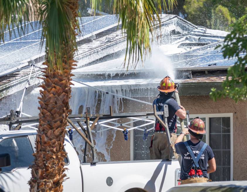 Las Vegas firefighters put out a house fire in the northwest Las Vegas Valley on the 4000 block ...