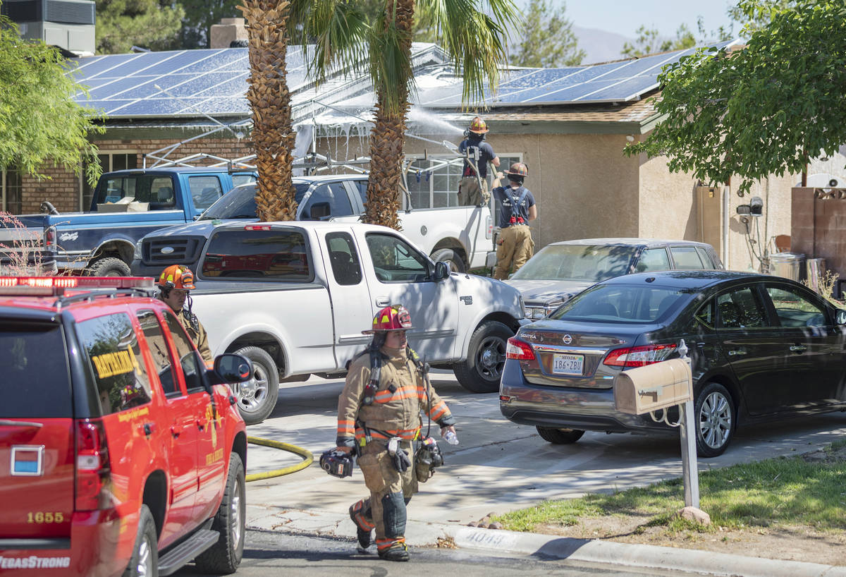 Las Vegas firefighters put out a house fire in the northwest Las Vegas Valley on the 4000 block ...