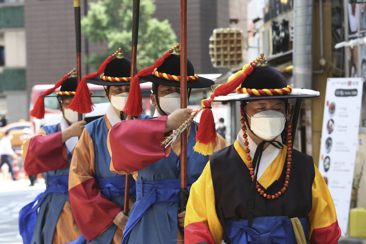 South Korean Imperial guards wearing face masks to help protect against the spread of the new c ...