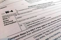 In a Feb. 5, 2020, file photo, a W-4 form is viewed in New York. As the coronavirus pandemic to ...