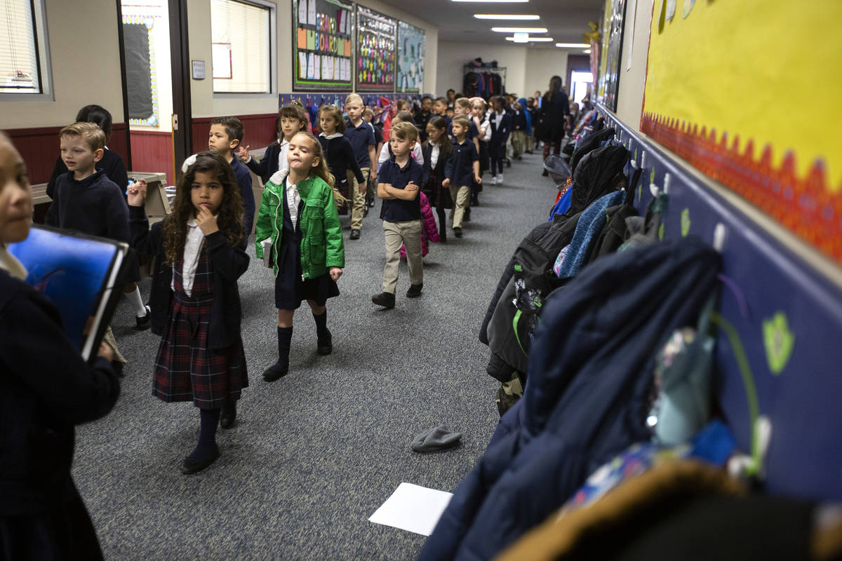 Students at American Preparatory Academy head to their reading groups on Thursday, Feb. 13, 202 ...