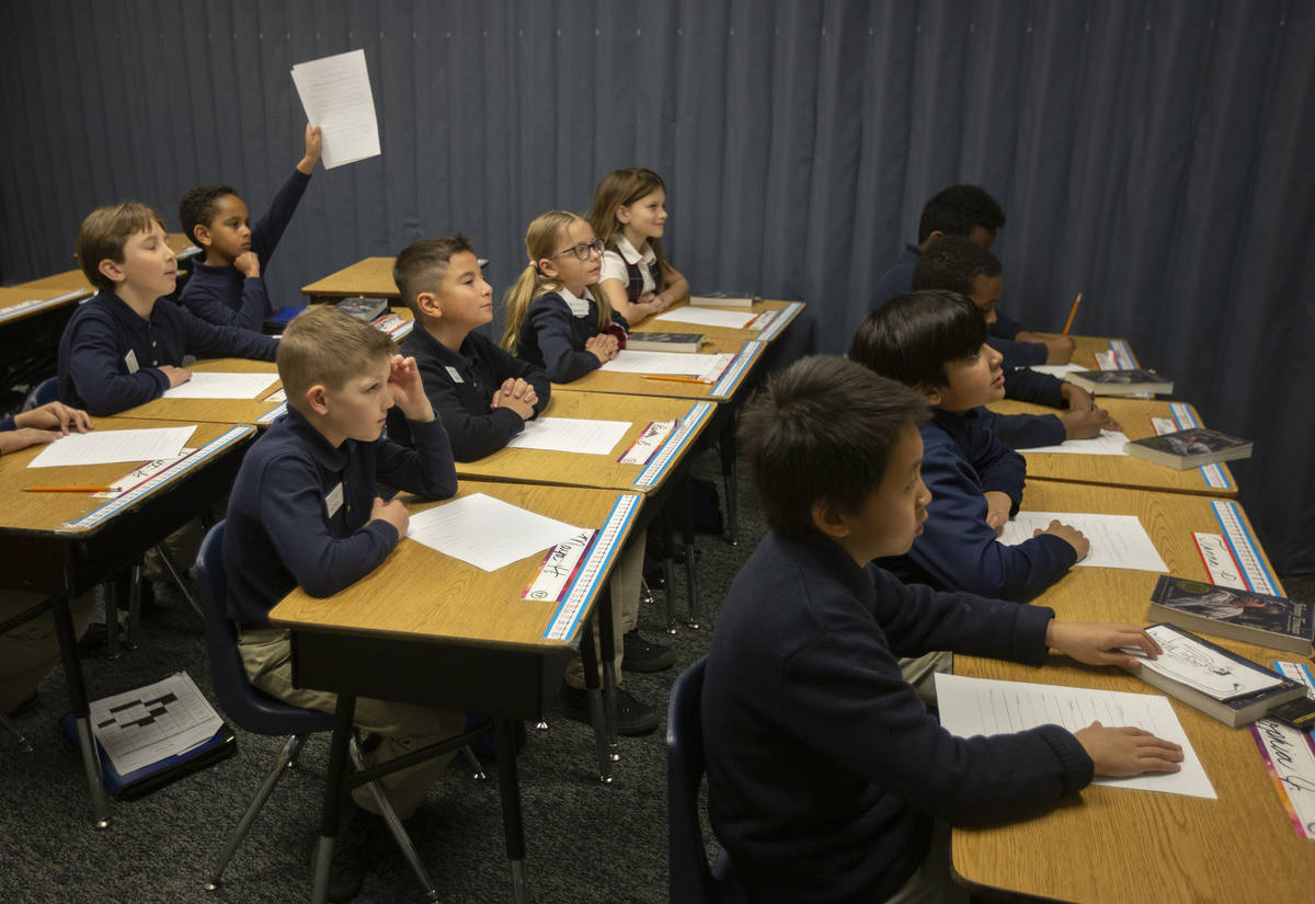 Nicole Doney's first grade class listens before they begin reading at American Preparatory Acad ...