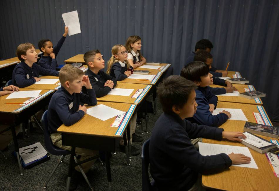Nicole Doney's first grade class listens before they begin reading at American Preparatory Acad ...