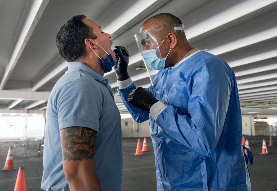 Clark County fireman Eddie Galaz, left, and Nevada National Guard Sgt. combat medic Steve Sanso ...