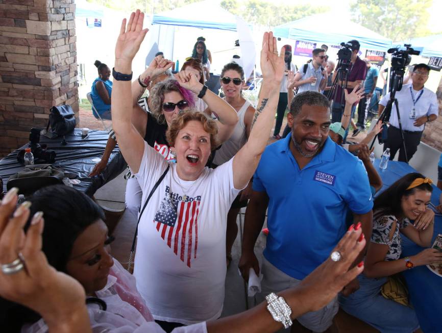 Donna West, Clark County Democrats chair, center, and U.S. Rep. Steven Horsford, D-Nev., cheer ...