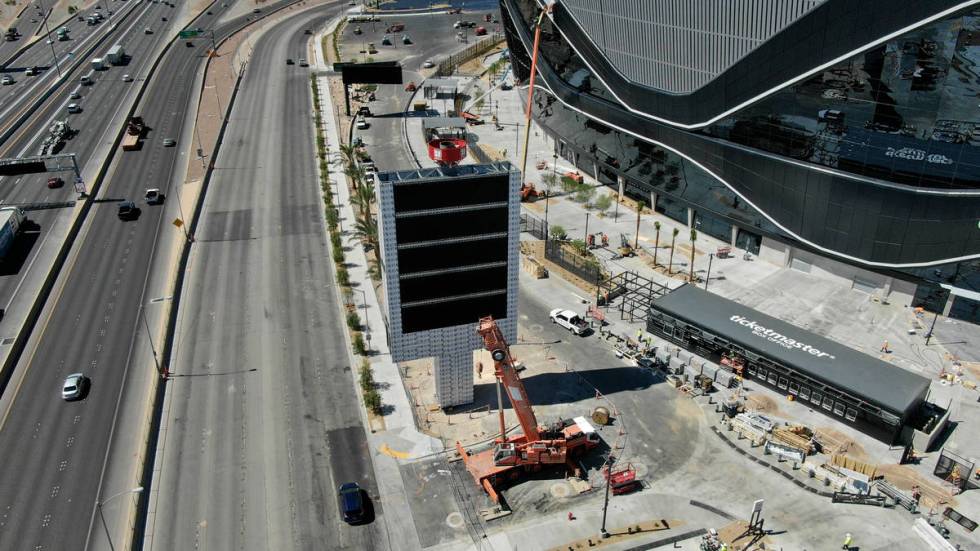 Aerial view of Allegiant Stadium's largest freestanding sign on Dean Martin Drive on the northe ...