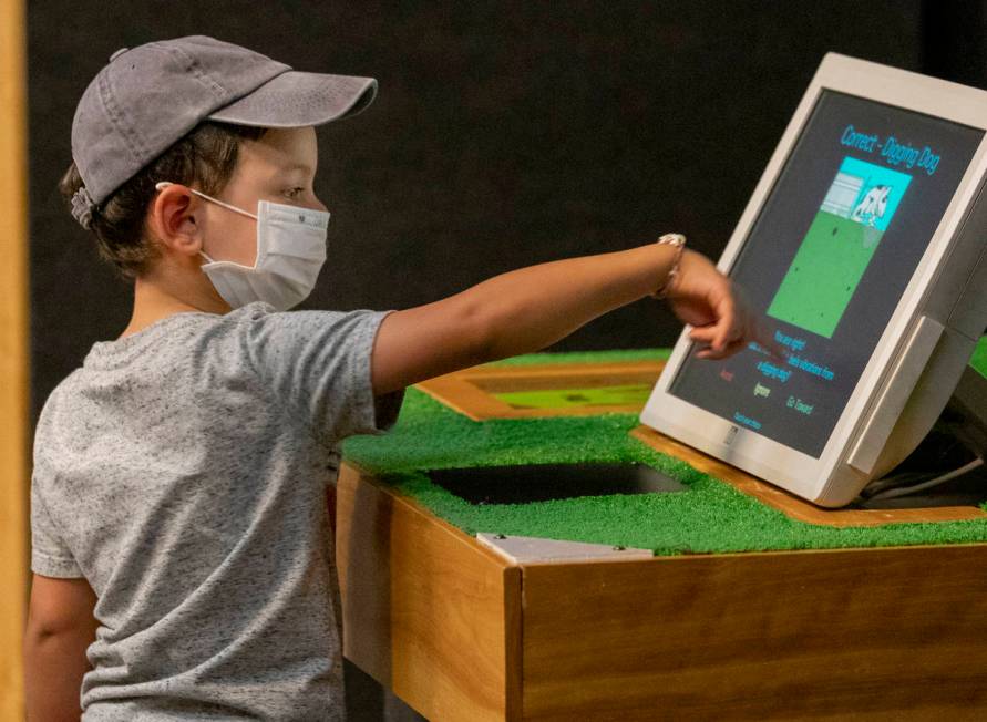 Jackson Trujillo, 4, of Las Vegas, explores the new exhibit at the Las Vegas Natural History Mu ...