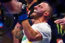 Alexander Volkanovski reacts after being declared the winner via unanimous decision over Max Ho ...