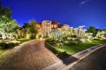 This 14,070-square-foot mansion in The Ridges in Summerlin will go to auction Aug. 1. It includ ...