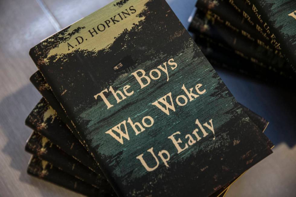 Copies of A.D. Hopkins novel "The Boys Who Woke Up Early" during a book release party ...