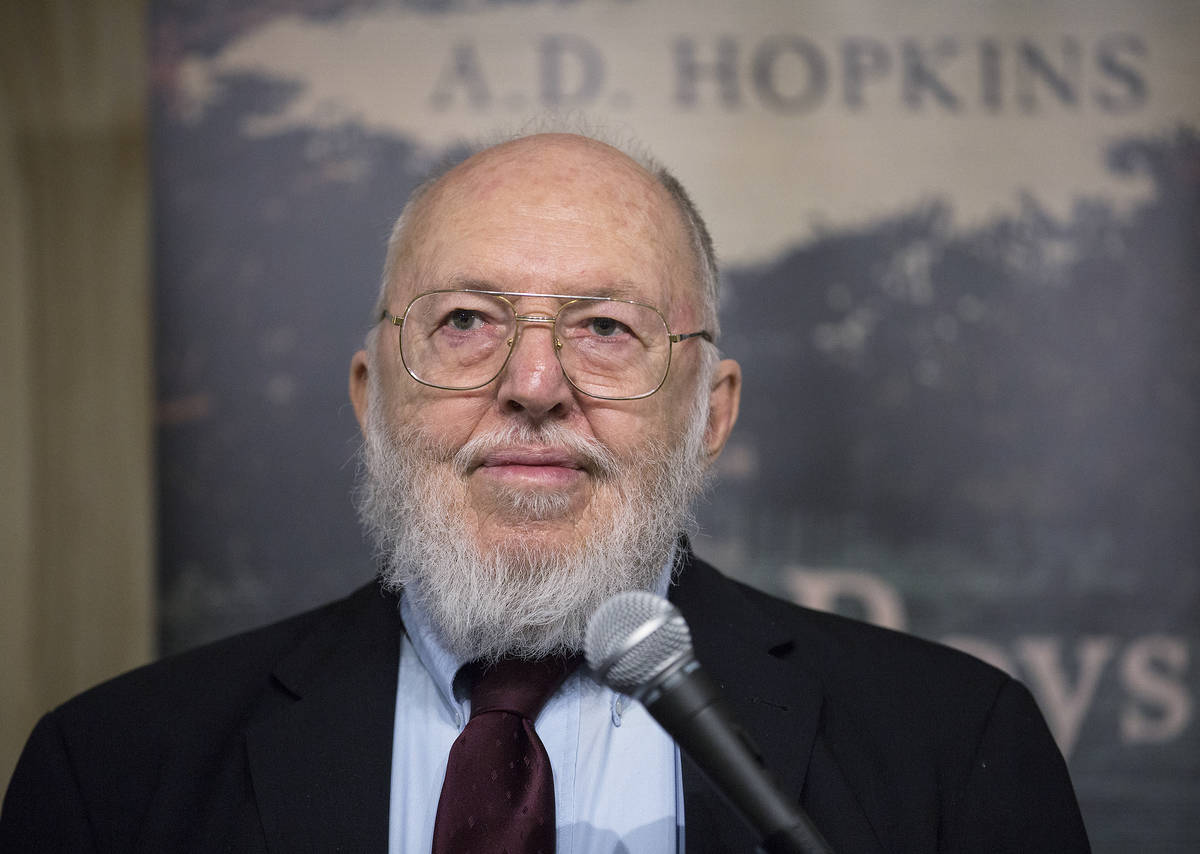 Author A.D. Hopkins reads from his novel "The Boys Who Woke Up Early" during a book r ...