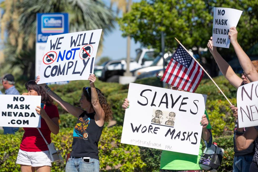 A "No Mask Protest" occurs at the intersection of West Sunset Road and North Stephani ...