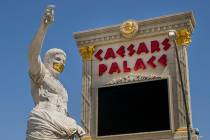 Caesar welcomes all out front while wearing a golden face mask following re-opening ceremonies ...