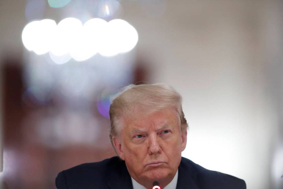President Donald Trump listens during a "National Dialogue on Safely Reopening America's S ...