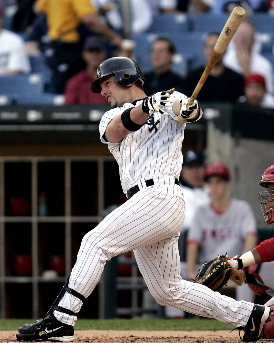This file photo shows Chicago White Sox' Aaron Rowand hitting a home run on June 1, 2005 in Chi ...