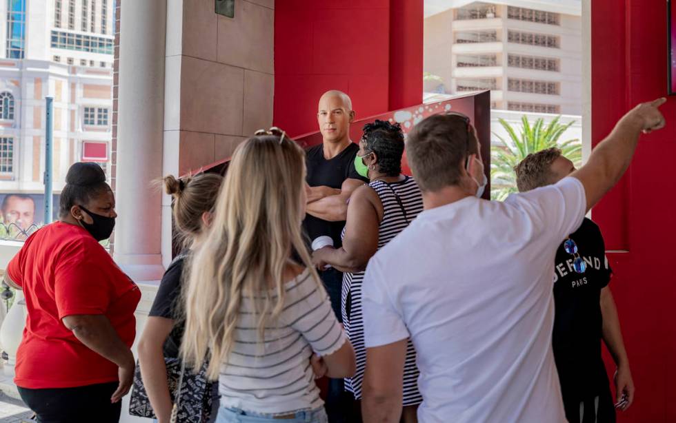 Tourist look at a wax figure of actor Vin Diesel in front of Madame Tussauds Las Vegas wax muse ...