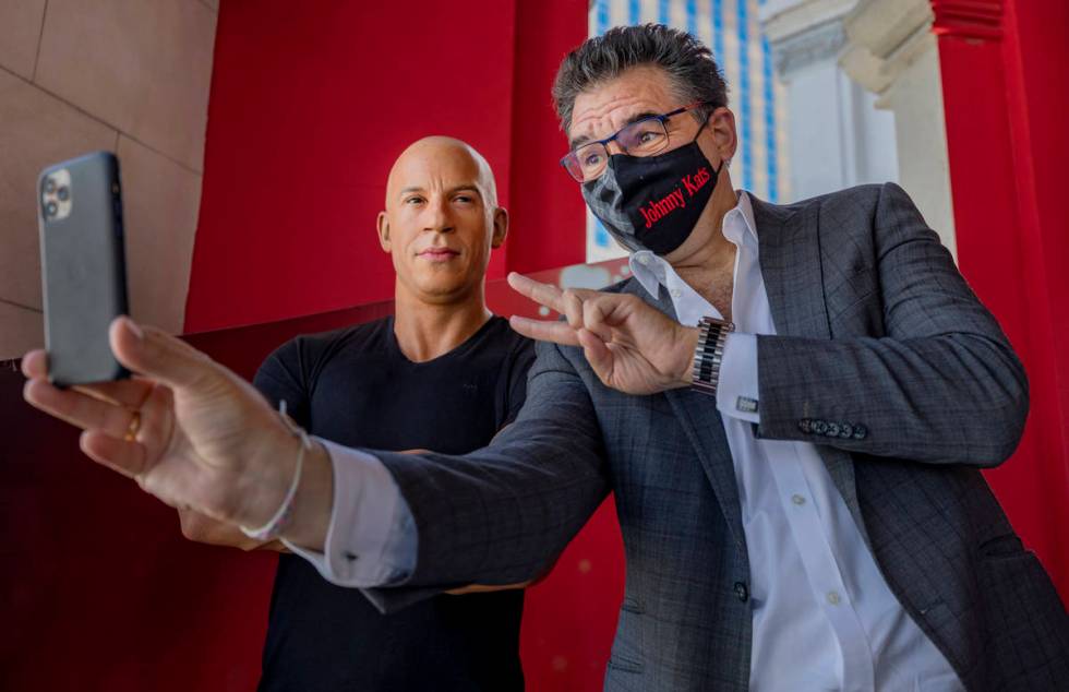 John Katsilometes takes a selfie with a wax figure of actor Vin Diesel in front of Madame Tussa ...