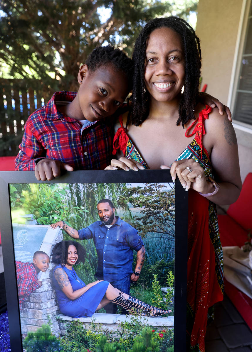 Alana Dixon-McAllister, 38, and her stepson, Bryce, 10, with a family photo including Dixon-McA ...