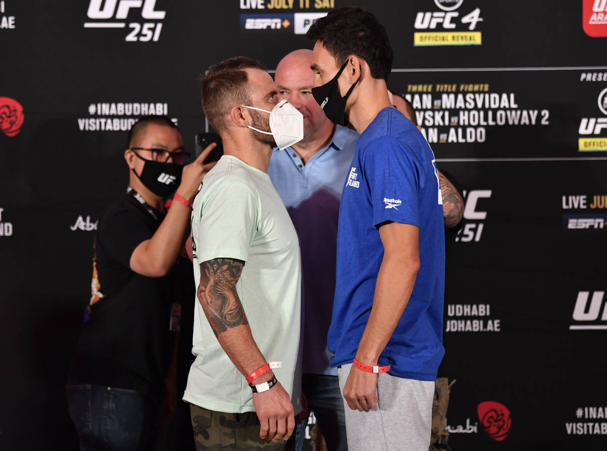 ABU DHABI, UNITED ARAB EMIRATES - JULY 10: (L-R) Opponents Alexander Volkanovski of Australia a ...