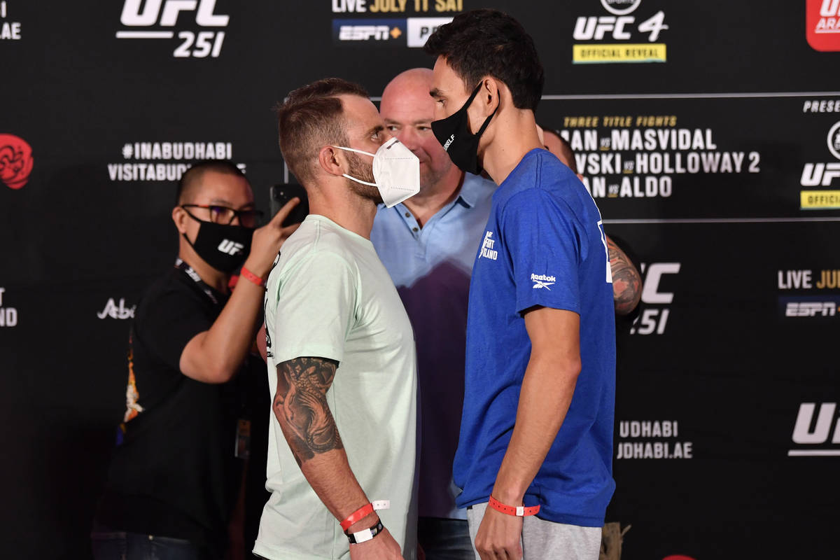 ABU DHABI, UNITED ARAB EMIRATES - JULY 10: (L-R) Opponents Alexander Volkanovski of Australia a ...