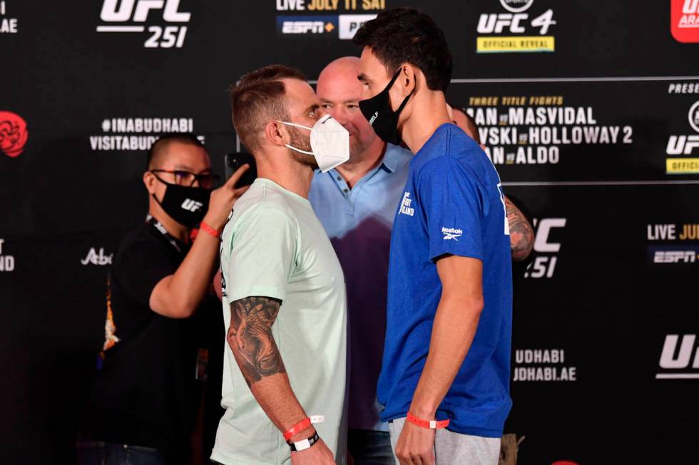 ABU DHABI, UNITED ARAB EMIRATES - JULY 10: (L-R) Opponents Alexander Volkanovski of Australia a ...