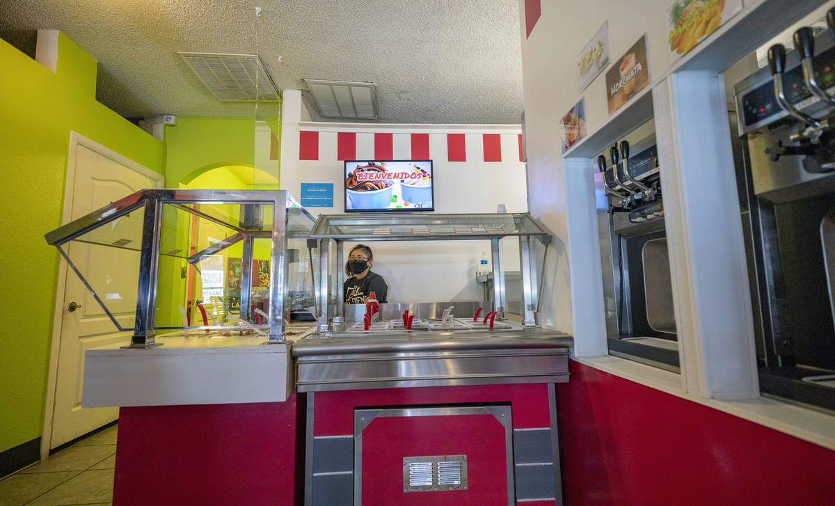 Alma Perez waits for customers at the frozen yogurt stand inside of El Menudazo, in North Las V ...