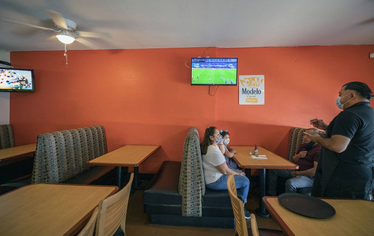 Individuals order lunch at El Menudazo, in North Las Vegas on Friday, July 10, 2020. (Elizabeth ...