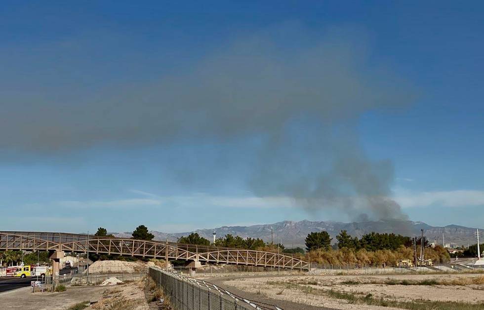 Clark County firefighters were called to a brush fire in east Las Vegas near Royal Links Golf C ...