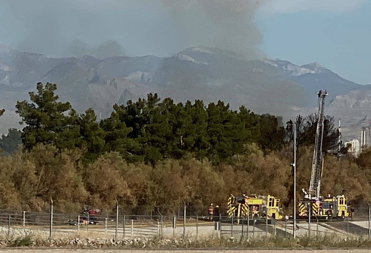 Clark County firefighters were called to a brush fire in east Las Vegas near Royal Links Golf C ...
