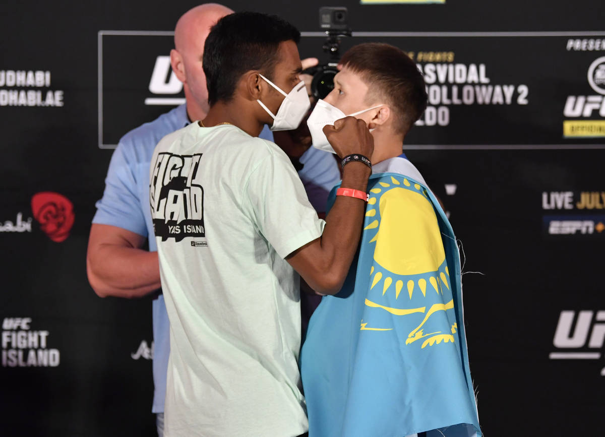 ABU DHABI, UNITED ARAB EMIRATES - JULY 10: (L-R) Opponents Raulian Paiva of Brazil and Zhalgas ...