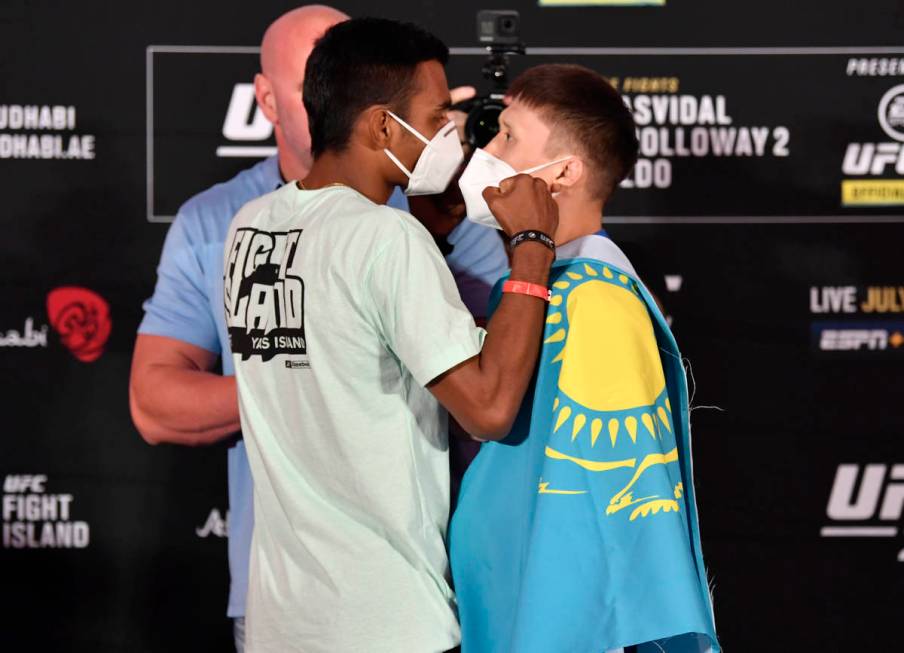 ABU DHABI, UNITED ARAB EMIRATES - JULY 10: (L-R) Opponents Raulian Paiva of Brazil and Zhalgas ...