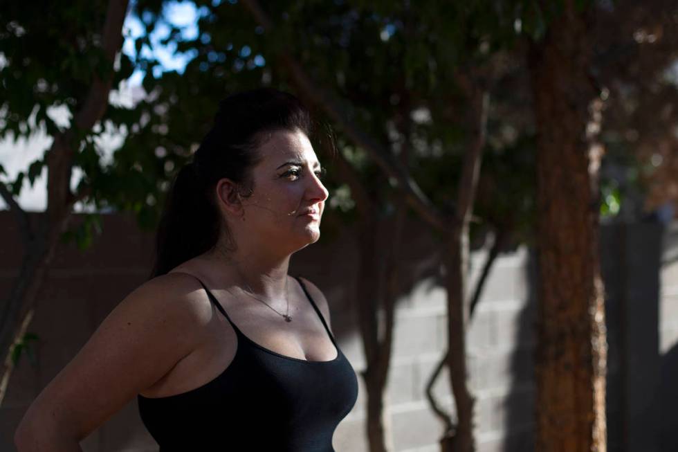 Alexis Cossman stands for a portrait in her backyard after her shift at Red Lobster on Wednesda ...