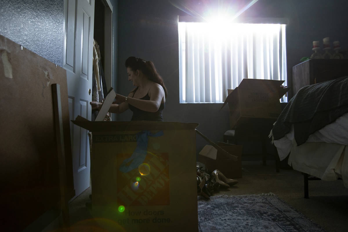 Alexis Cossman unpacks her last box as she moves into her roommate's newly purchased home on We ...