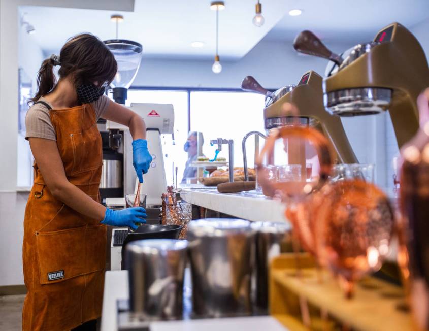 Quianna Rodriguez, a barista at Take It Easy, prepares the drink Somewhere in Kentucky in Las V ...